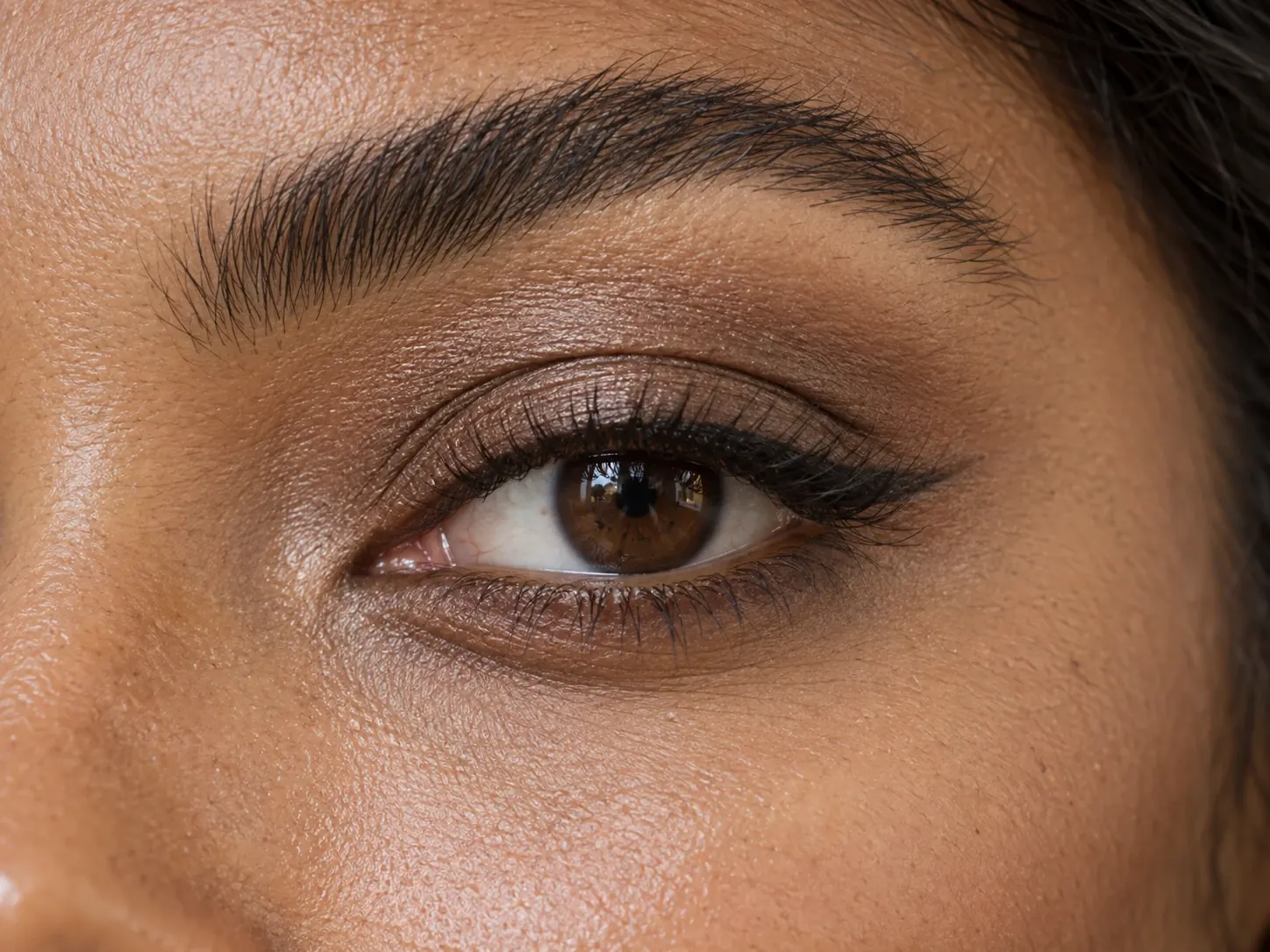 A close view showing eye makeup placement